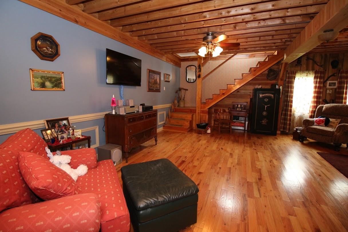 2185 Loops Road Rainelle, WV 25962 - Photo 3 of 109 a living room with furniture and a flat screen tv