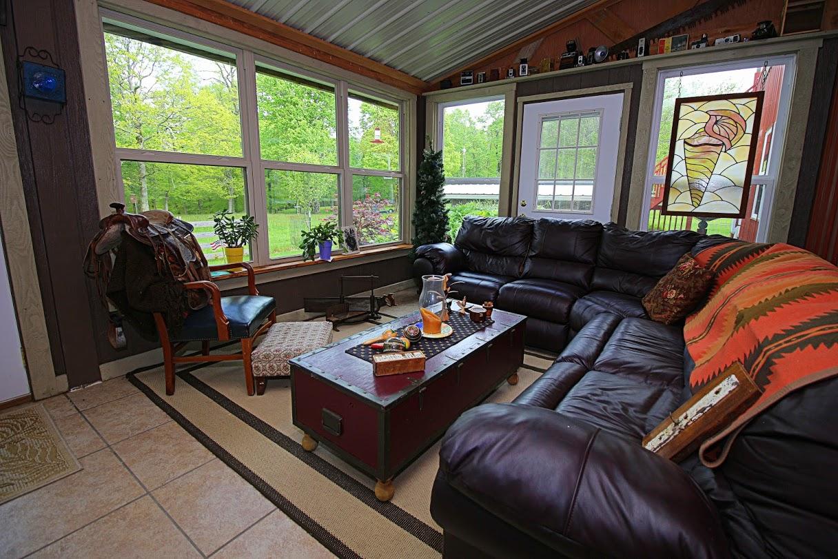 2185 Loops Road Rainelle, WV 25962 - Photo 21 of 109 a living room with furniture and a floor to ceiling window