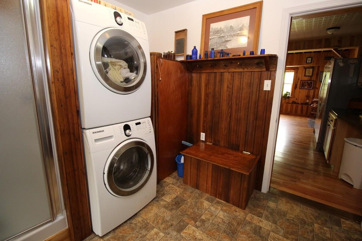 2185 Loops Road Rainelle, WV 25962 - Photo 38 of 109 a view of a storage and utility room with washer and dryer