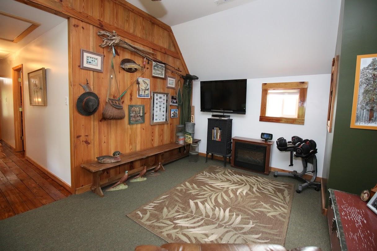 2185 Loops Road Rainelle, WV 25962 - Photo 50 of 109 a living room with furniture and a flat screen tv
