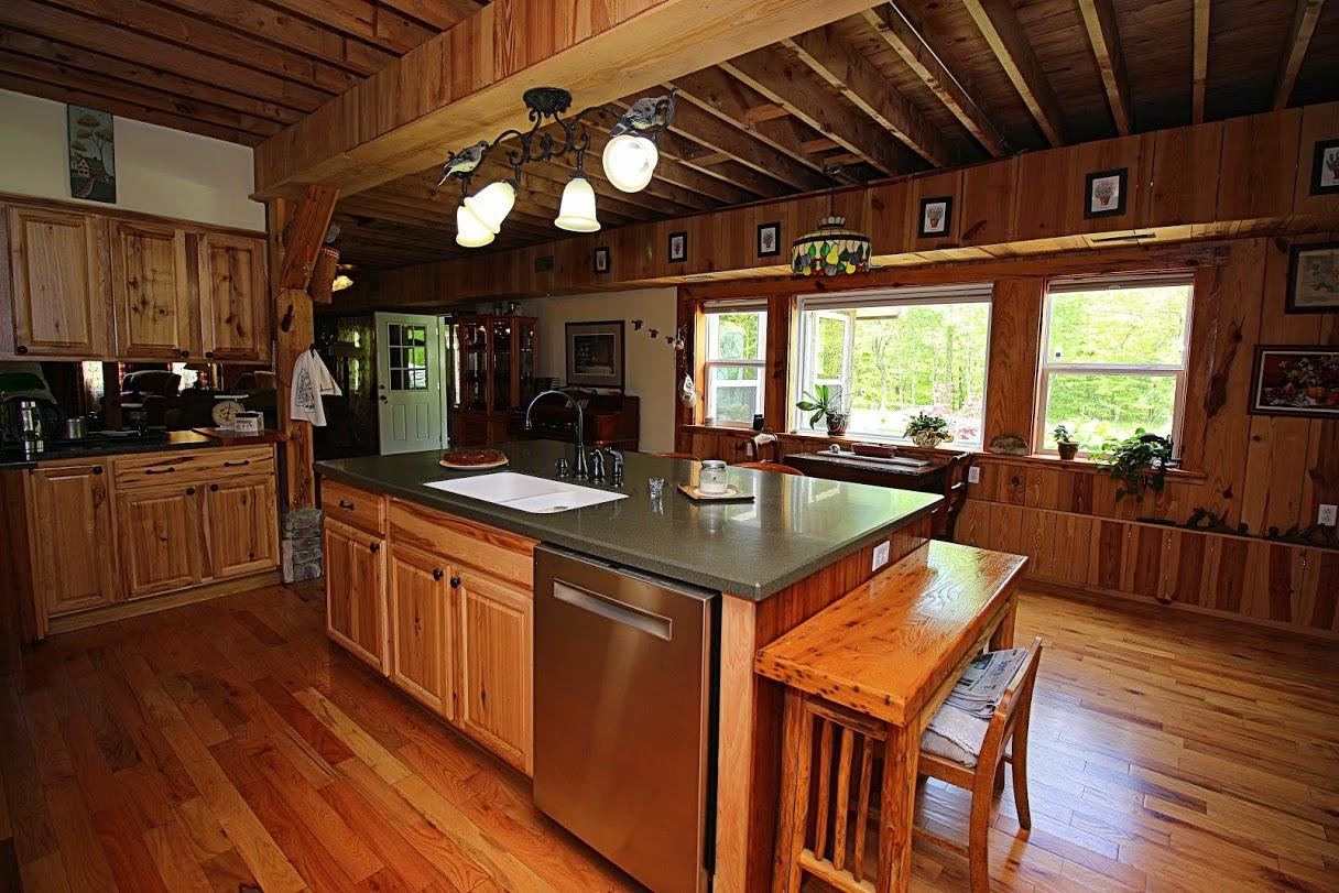2185 Loops Road Rainelle, WV 25962 - Photo 6 of 109 a kitchen with stainless steel appliances granite countertop a sink a stove and a wooden floors