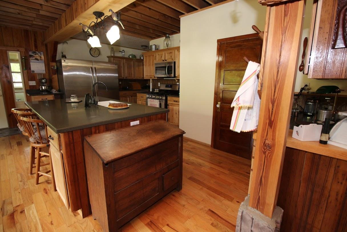 2185 Loops Road Rainelle, WV 25962 - Photo 55 of 109 a kitchen with stainless steel appliances granite countertop a sink a stove and a wooden cabinets
