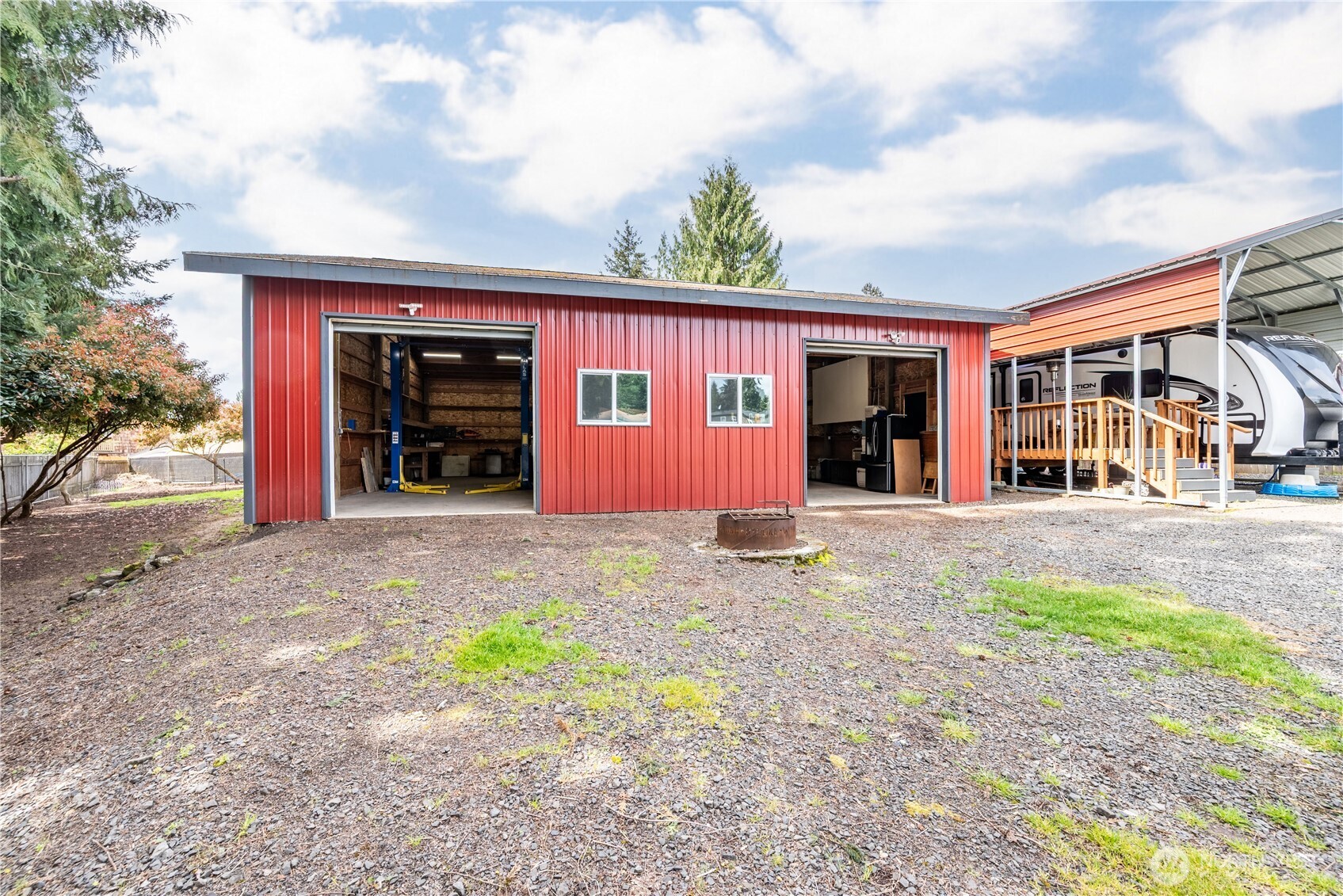 116 Mason Road Silverlake, WA 98645 - Photo 23 of 32 a view of a house with a yard and garage