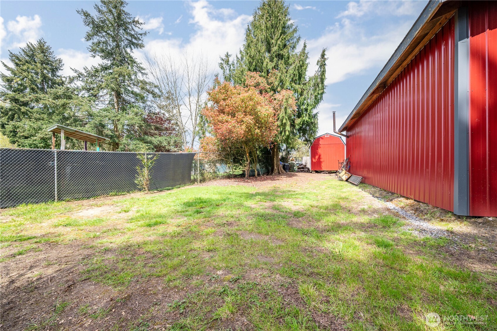 116 Mason Road Silverlake, WA 98645 - Photo 7 of 32 a view of a backyard with a small cabin