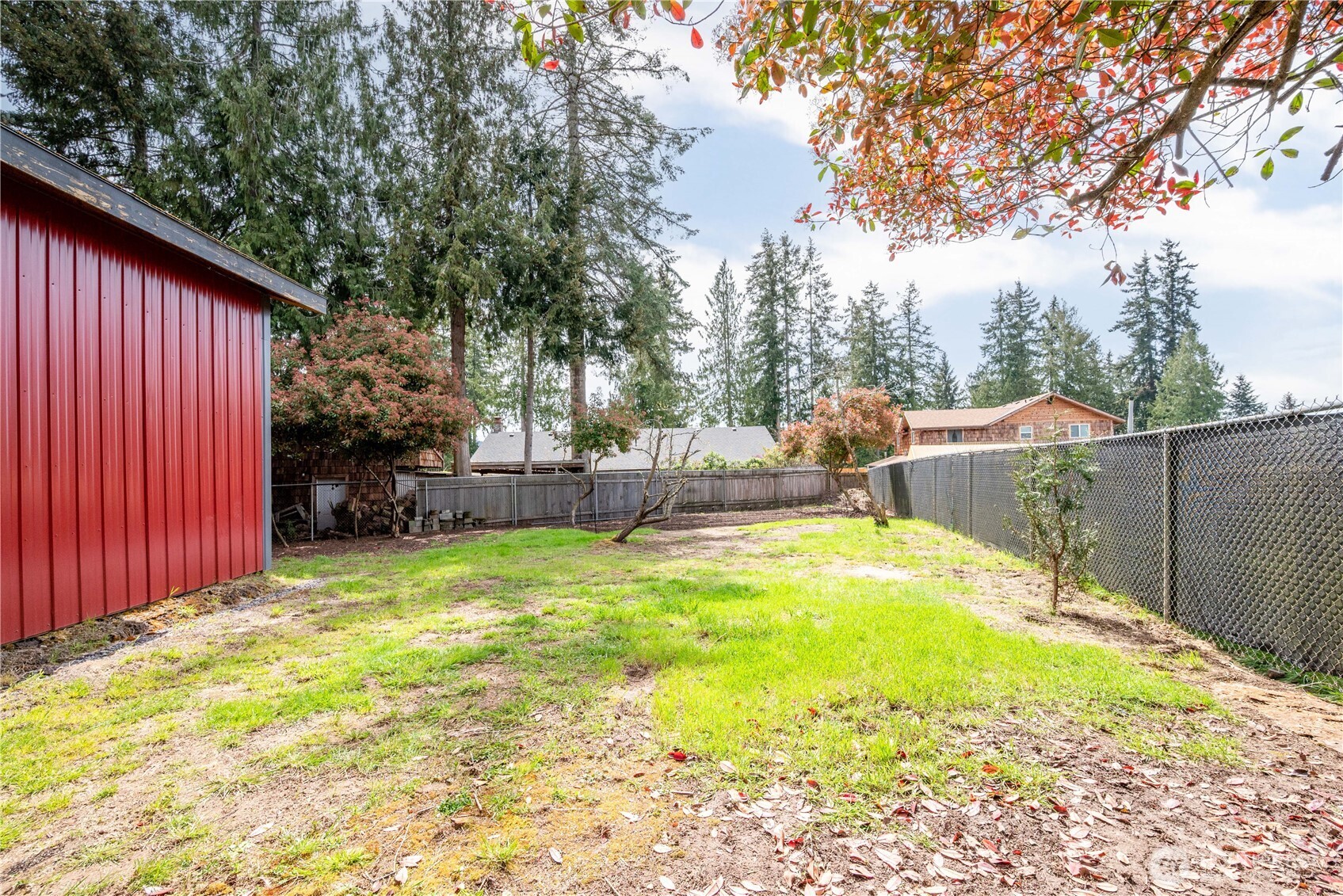 116 Mason Road Silverlake, WA 98645 - Photo 8 of 32 a view of a backyard with a small cabin