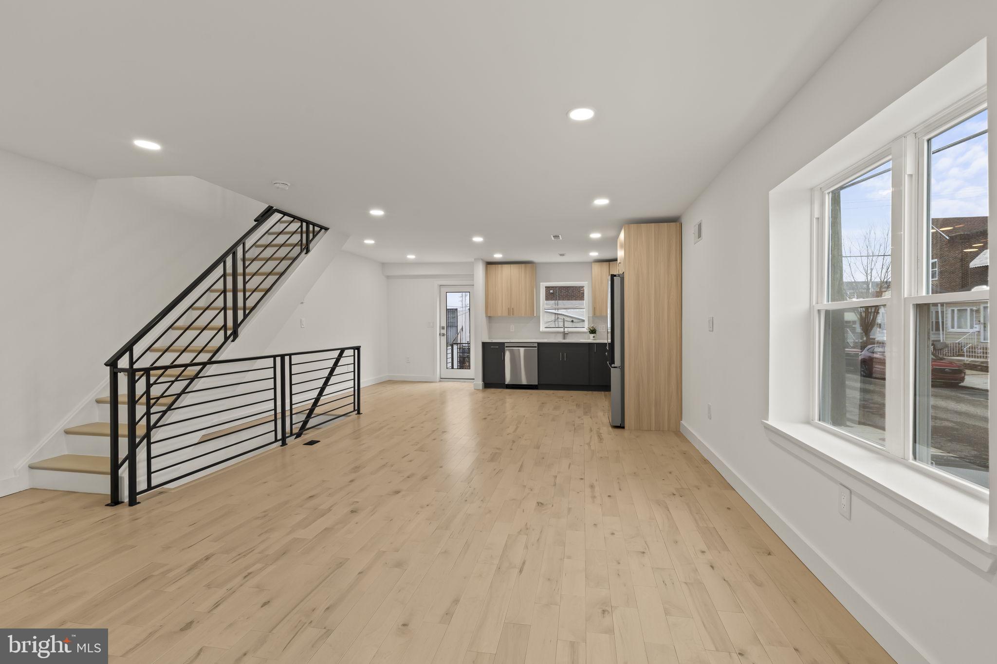 2747 South Beulah Street Philadelphia, PA 19148 - Photo 12 of 37 a view of a hallway with wooden floor and windows