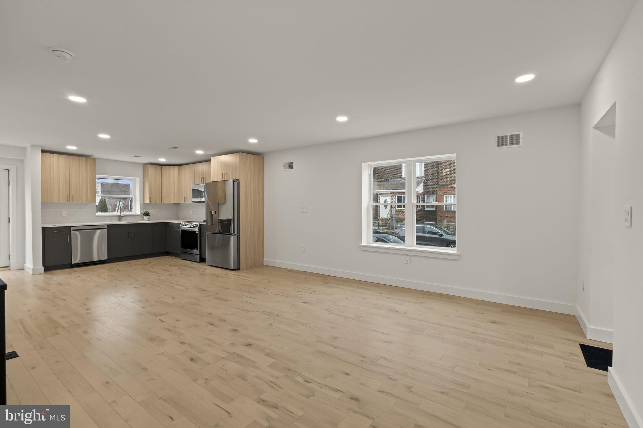 2747 South Beulah Street Philadelphia, PA 19148 - Photo 13 of 37 a view of an empty room with a kitchen