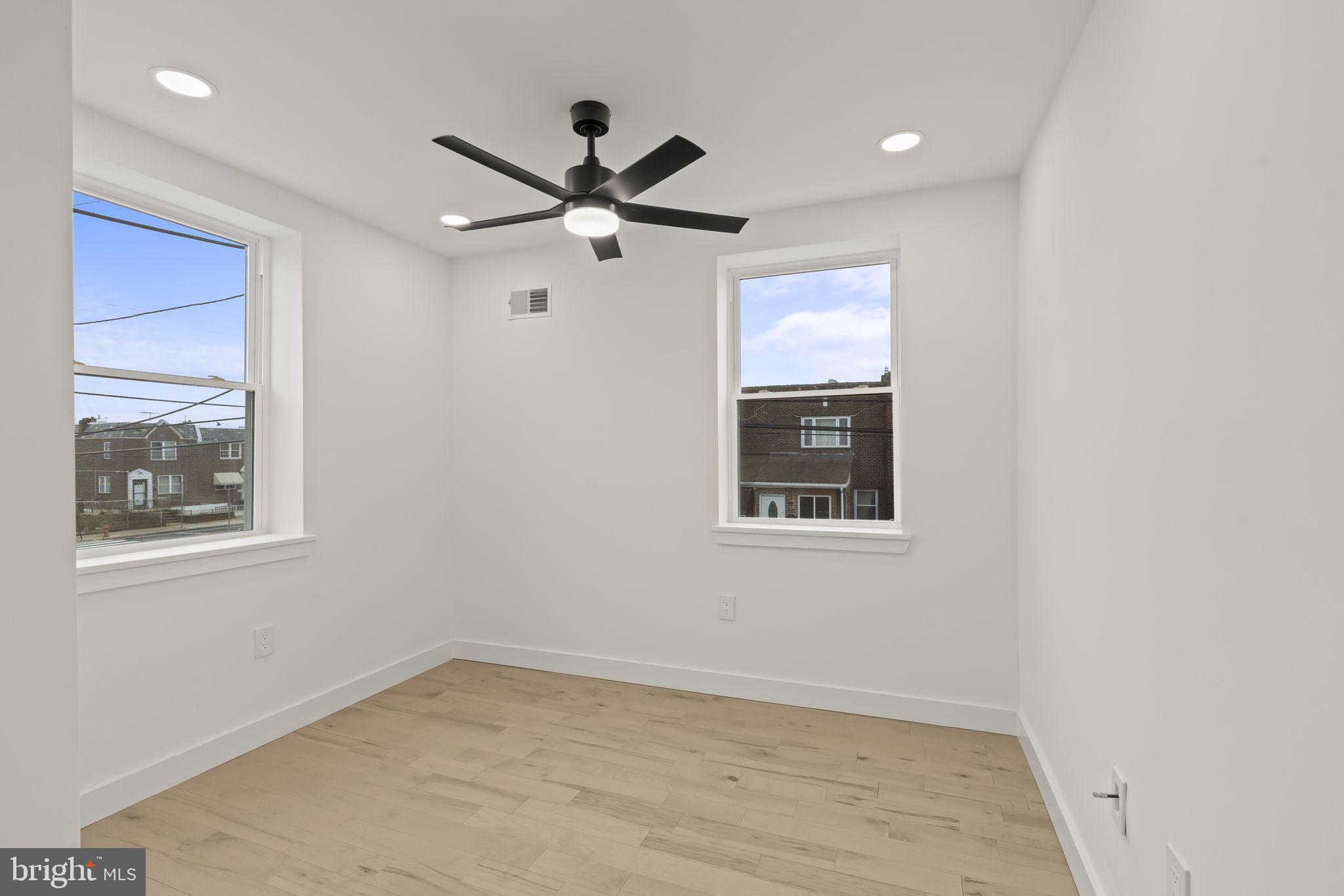 2747 South Beulah Street Philadelphia, PA 19148 - Photo 17 of 37 a view of a big room with wooden floor and windows
