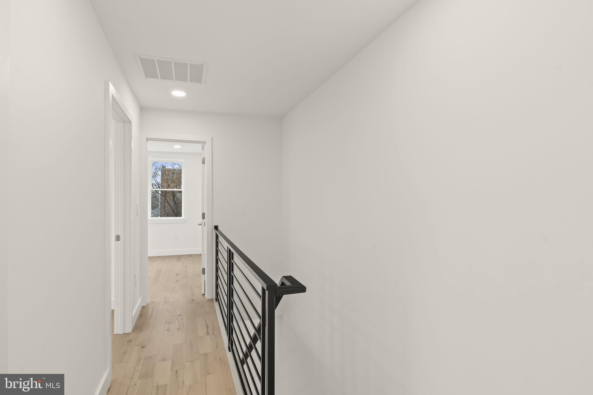 2747 South Beulah Street Philadelphia, PA 19148 - Photo 24 of 37 a view of a hallway with wooden floor and entryway