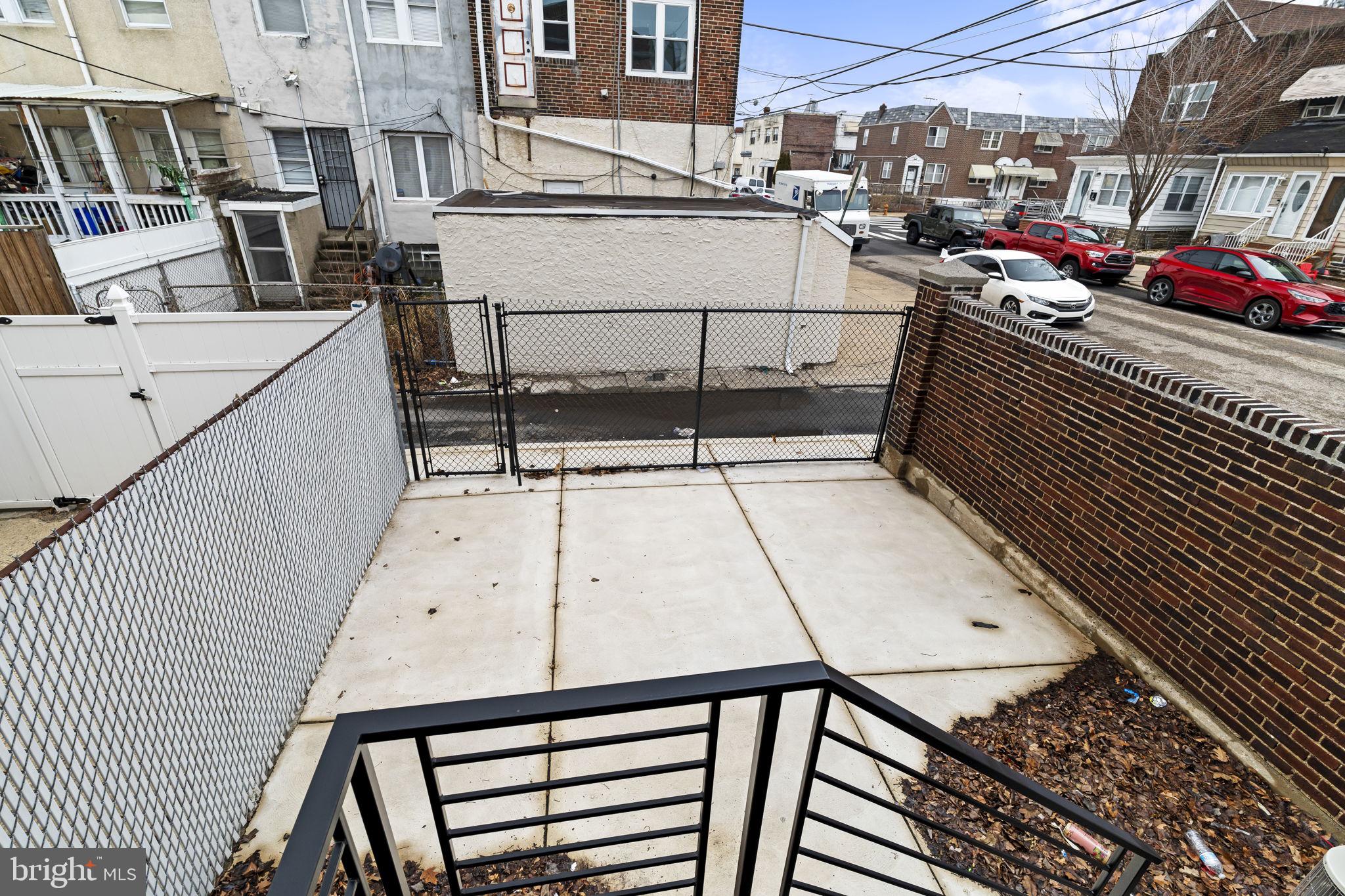 2747 South Beulah Street Philadelphia, PA 19148 - Photo 32 of 37 a view of a patio with table and chairs