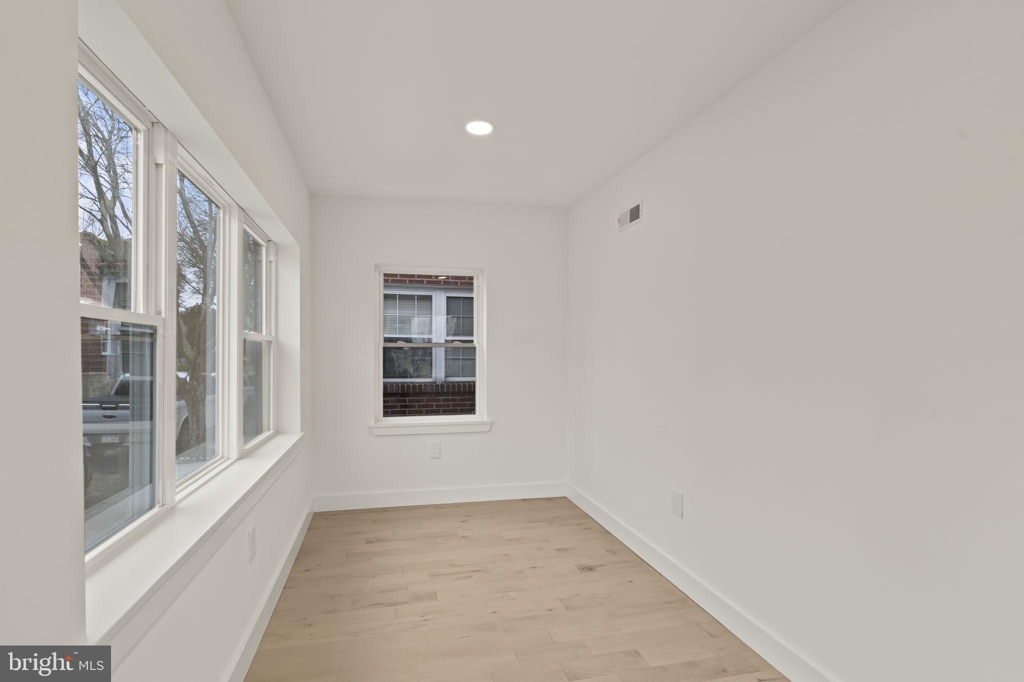 2747 South Beulah Street Philadelphia, PA 19148 - Photo 6 of 37 a view of an empty room with a window