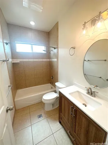 a bathroom with a double vanity sink toilet and shower
