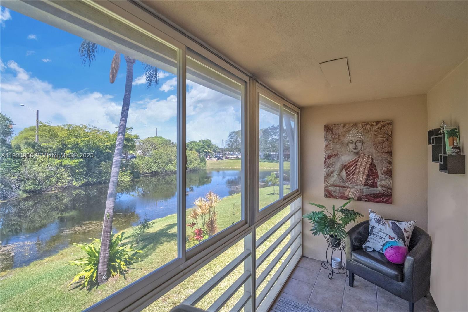 244 Durham, Unit 244 Deerfield Beach, FL 33442 - Photo 12 of 20 a balcony with furniture and a potted plant