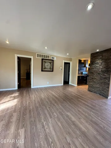 a view of a living room a dining room and wooden floor