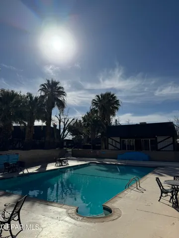 a kitchen with stainless steel appliances granite countertop a refrigerator a sink and a stove