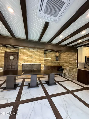 a room with lots of furniture and appliances