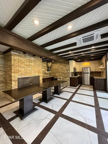 a view of swimming pool with outdoor seating