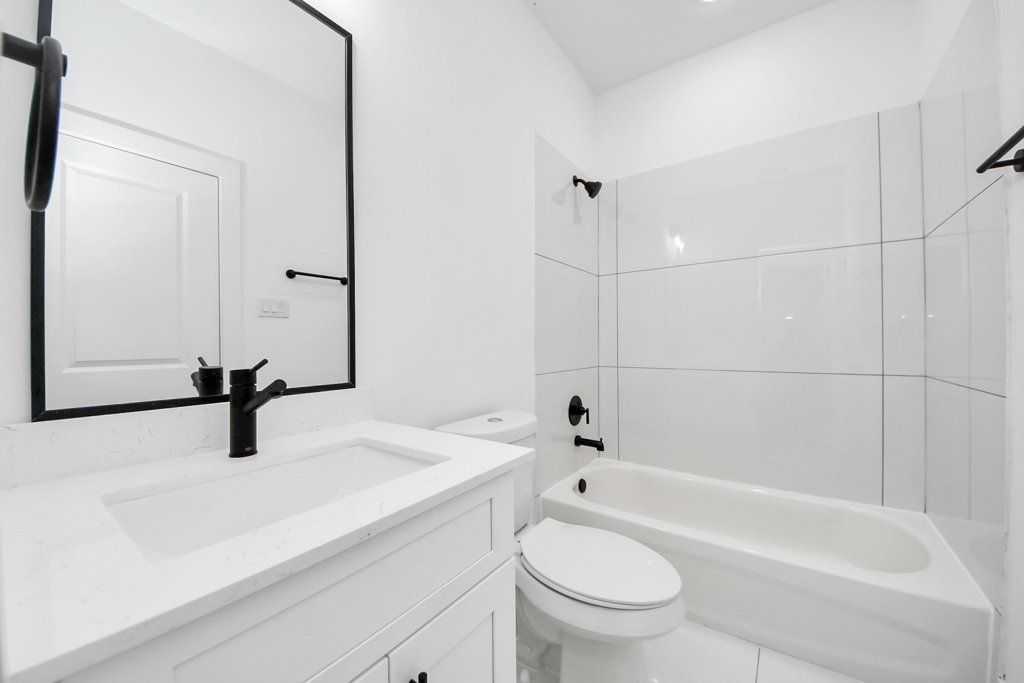 4806 Cochran Street Houston, TX 77009 - Photo 37 of 43 a bathroom with a sink a toilet and bathtub