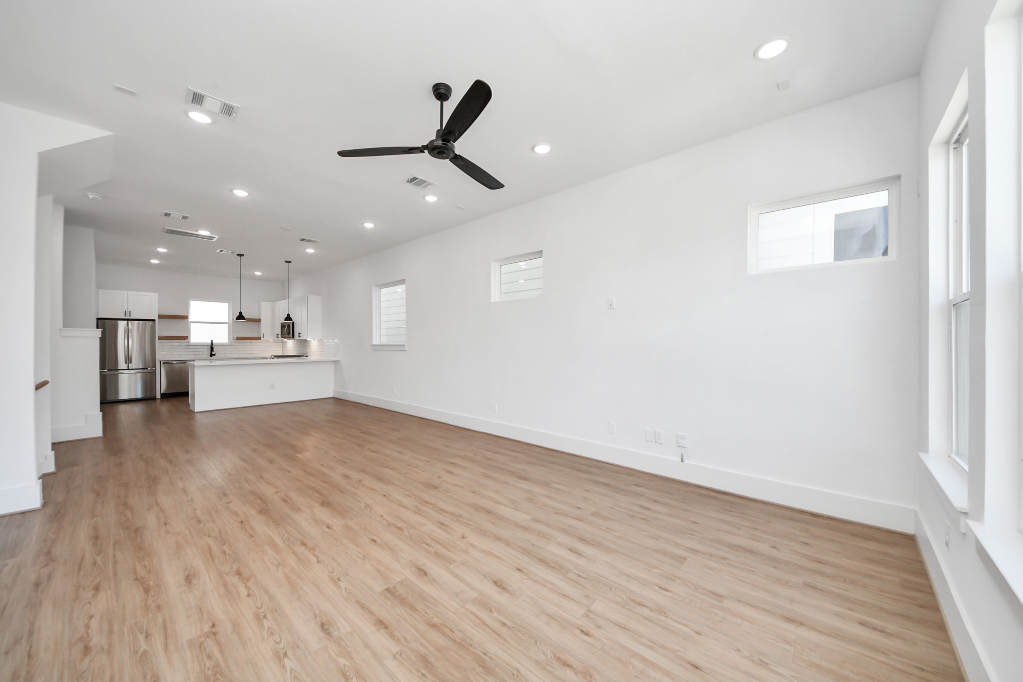 4806 Cochran Street Houston, TX 77009 - Photo 5 of 43 a view of kitchen with kitchen island wooden floor center island and stainless steel appliances