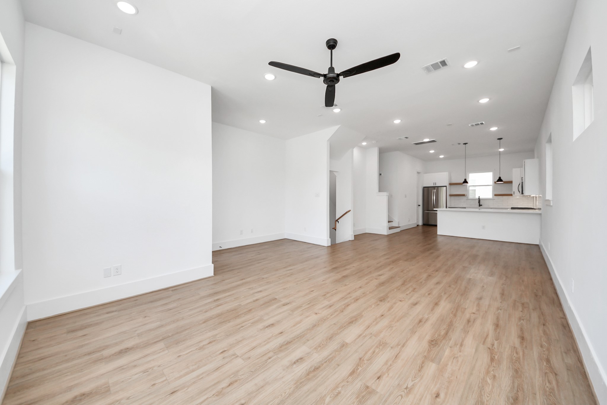 4806 Cochran Street Houston, TX 77009 - Photo 8 of 43 a view of a kitchen with a sink and a refrigerator