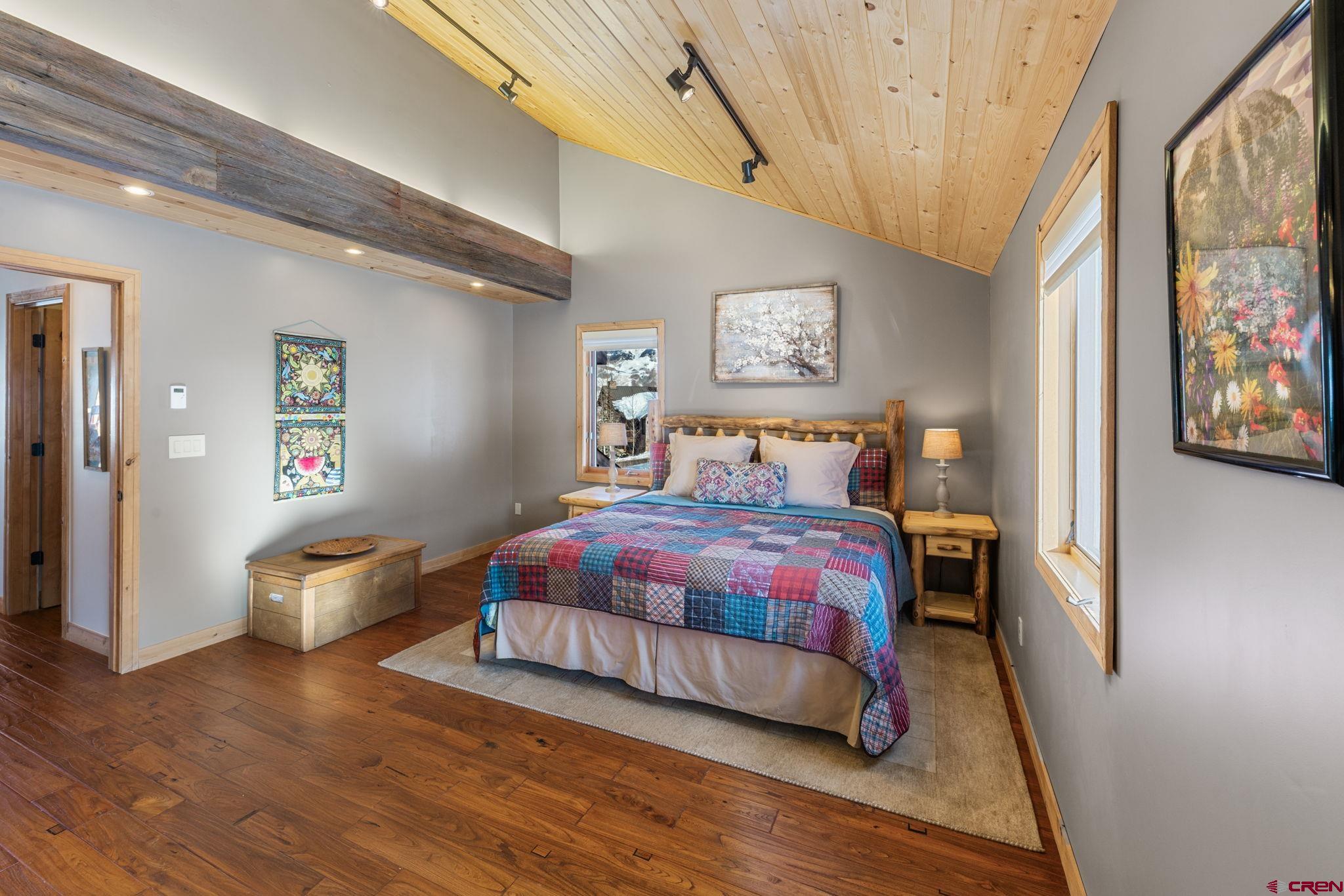 10 Ruby Drive Crested Butte, CO 81225 - Photo 21 of 42 a bedroom with a bed and wooden floor