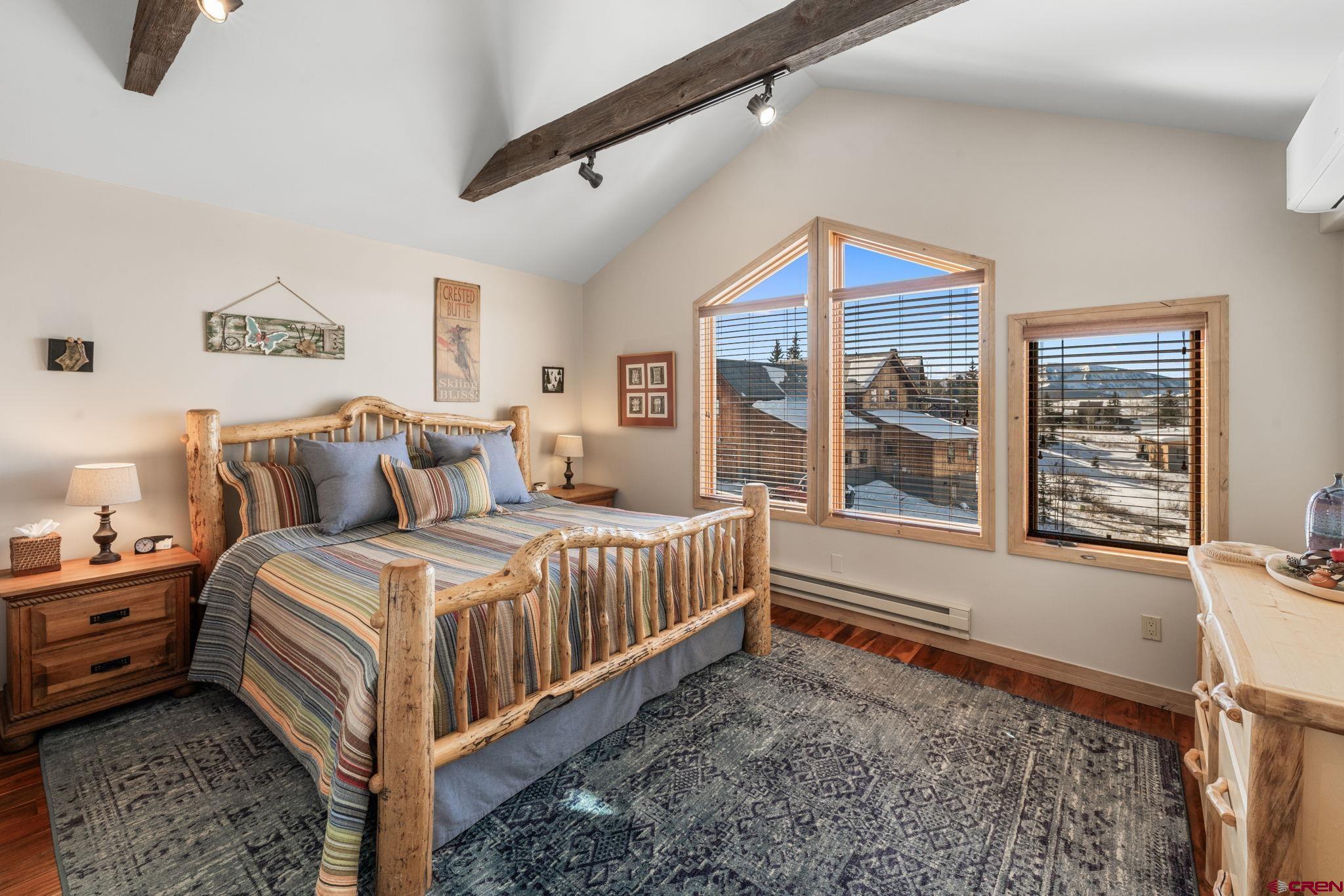 10 Ruby Drive Crested Butte, CO 81225 - Photo 24 of 42 a bedroom with a bed next to a window