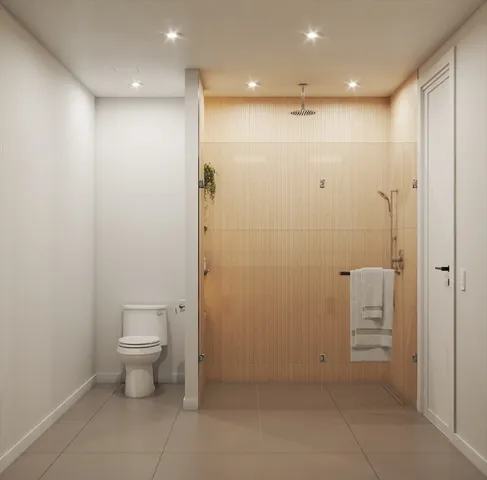 a bathroom with a shower a toilet and a sink