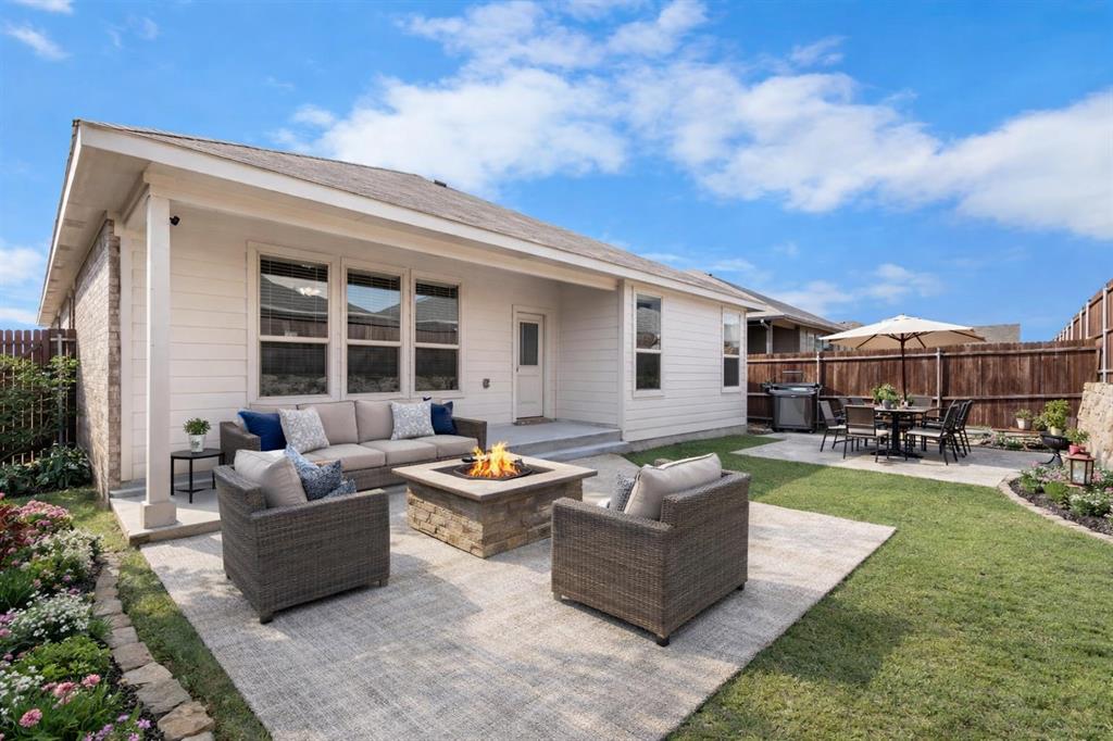 1045 Kirkham Way Fort Worth, TX 76247 - Photo 26 of 36 virtually staged patio area, outdoor lounge area, and an outdoor fire pit