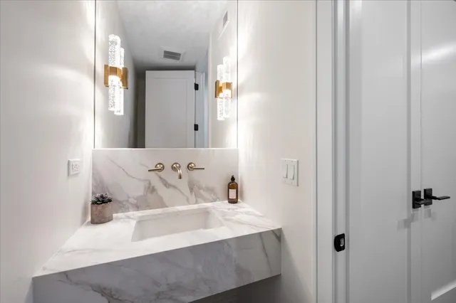 a bathroom with double vanity sinks double vanity tub shower and a mirror