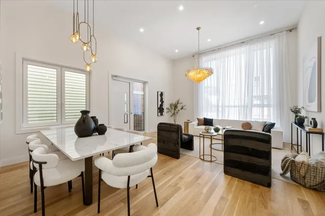 a kitchen with a table chairs stove and cabinets