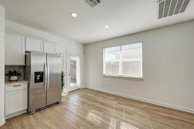 a kitchen with stainless steel appliances a refrigerator and a sink