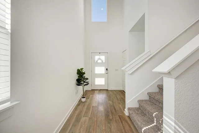 a view of entryway with wooden floor