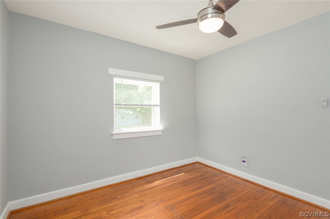 2441 Osborne Road Chester, VA 23831 - Photo 16 of 29 an empty room with a window and wooden floor