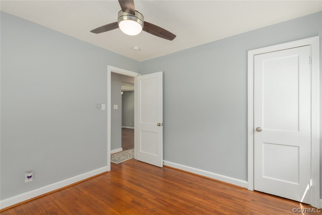2441 Osborne Road Chester, VA 23831 - Photo 17 of 29 an empty room with wooden floor a ceiling fan and closet area