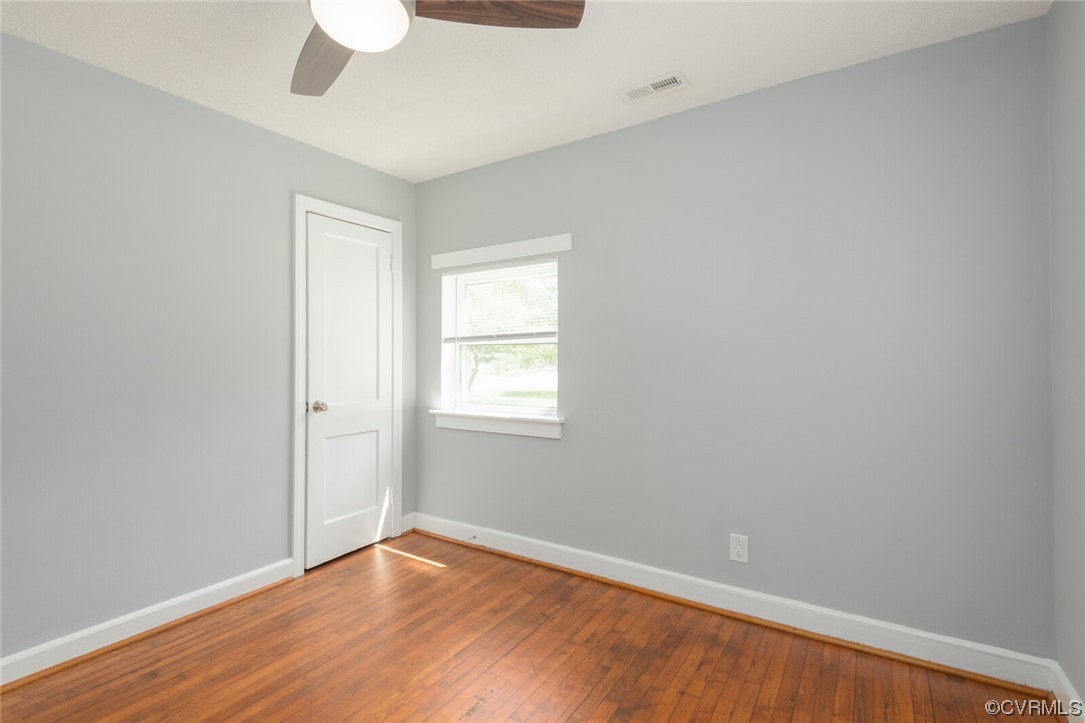 2441 Osborne Road Chester, VA 23831 - Photo 18 of 29 an empty room with a window and wooden floor