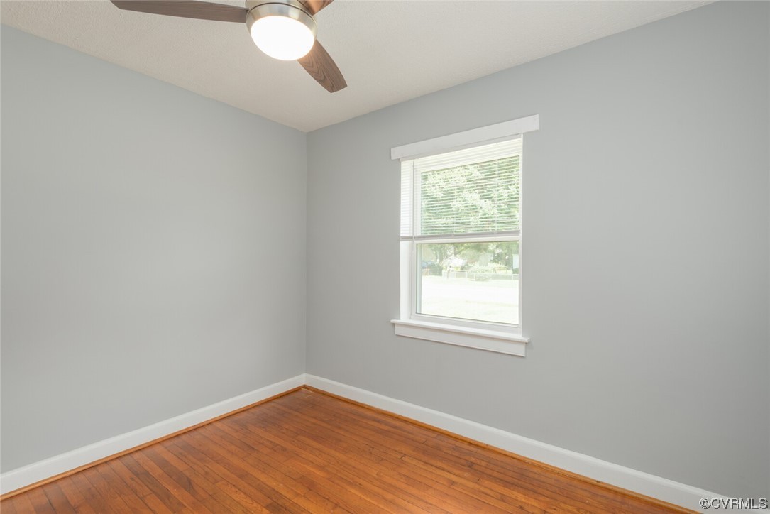 2441 Osborne Road Chester, VA 23831 - Photo 21 of 29 an empty room with wooden floor and windows