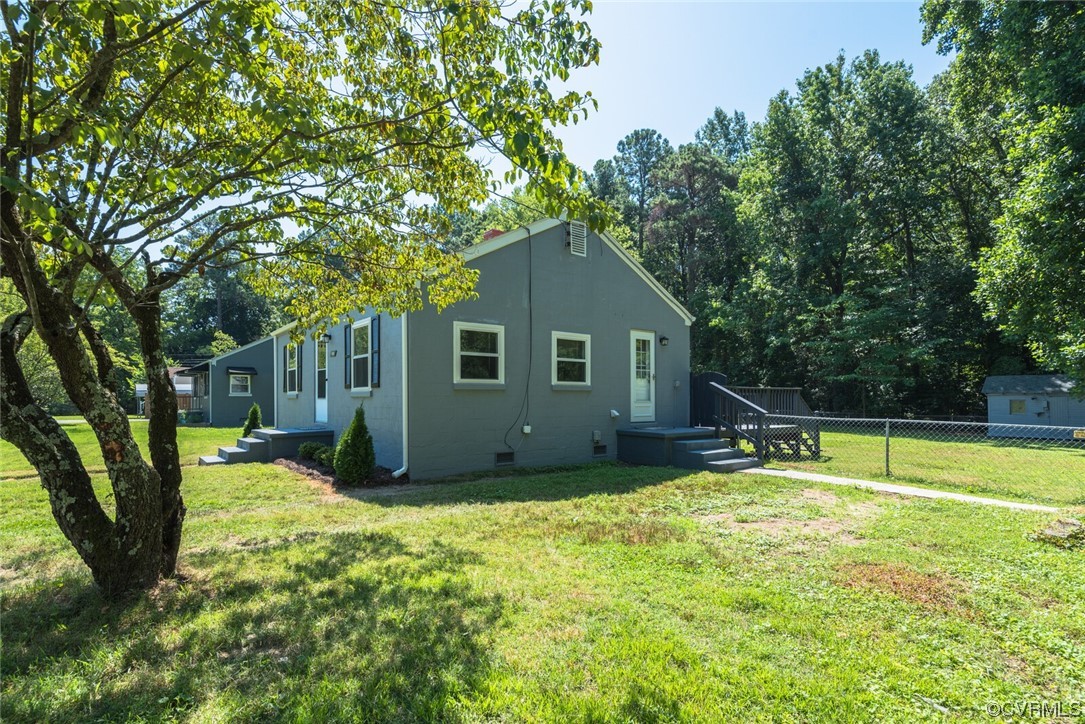 2441 Osborne Road Chester, VA 23831 - Photo 3 of 29 a view of a house with a backyard and a tree