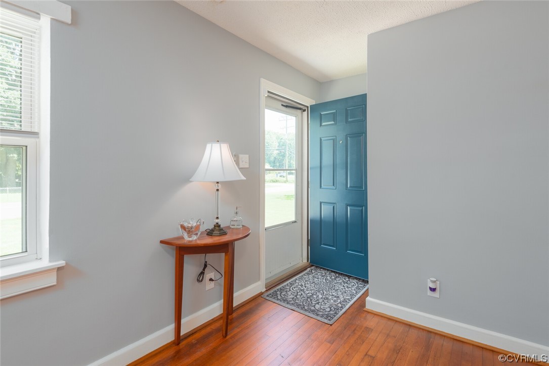 2441 Osborne Road Chester, VA 23831 - Photo 5 of 29 a room with wooden floor and a window