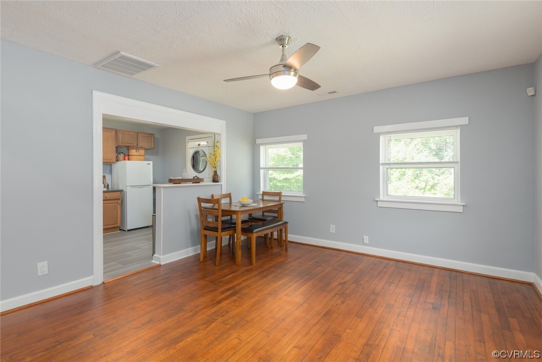 2441 Osborne Road Chester, VA 23831 - Photo 6 of 29 a view of a livingroom with furniture wooden floor and a window
