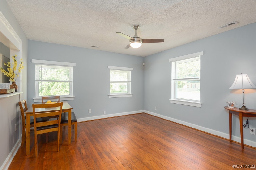 2441 Osborne Road Chester, VA 23831 - Photo 7 of 29 a view of room with wooden floor ceiling fan and windows
