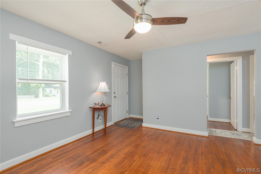 2441 Osborne Road Chester, VA 23831 - Photo 9 of 29 a view of empty room with wooden floor and fan