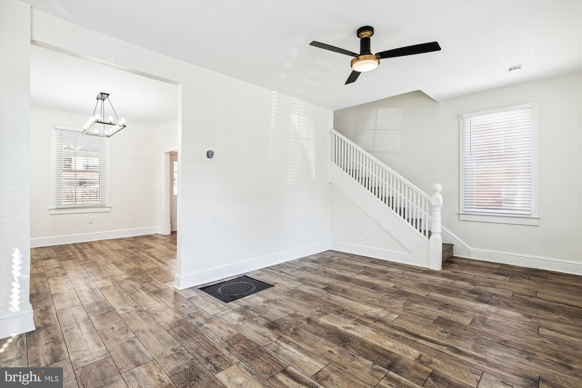 3107 9th Road North Arlington, VA 22201 - Photo 11 of 34 a view of a livingroom with wooden floor and a ceiling fan