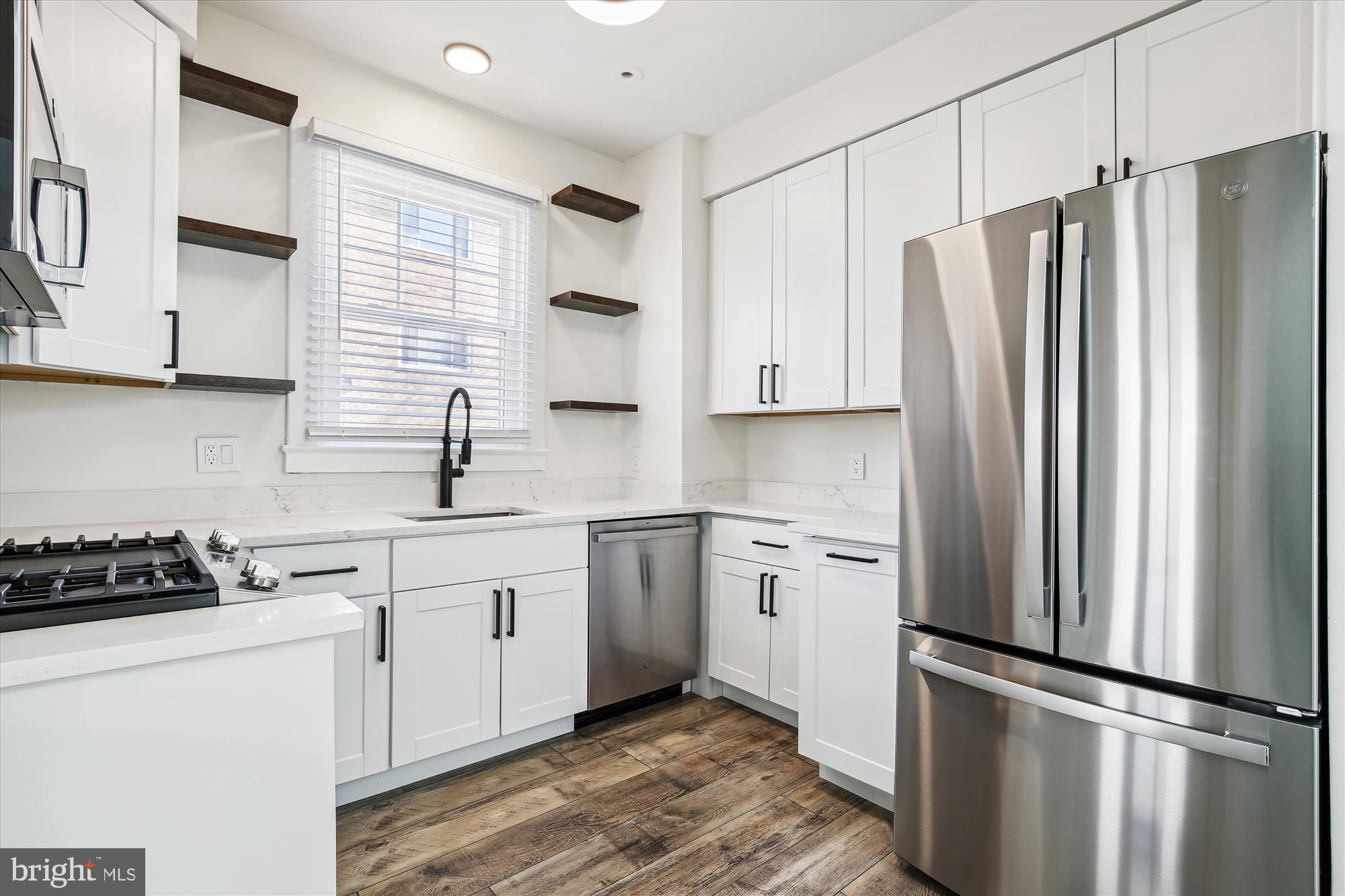 3107 9th Road North Arlington, VA 22201 - Photo 17 of 34 a kitchen with stainless steel appliances a refrigerator sink and cabinets