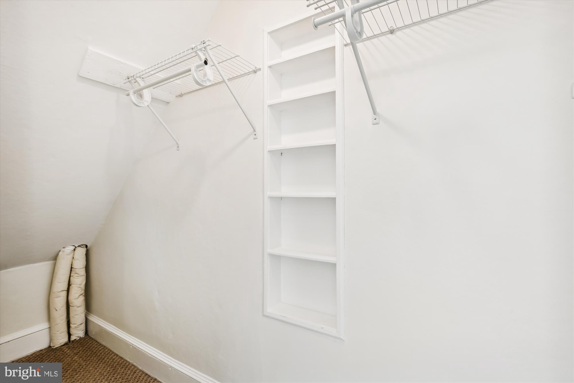 3107 9th Road North Arlington, VA 22201 - Photo 27 of 34 a view of walk in closet with empty racks