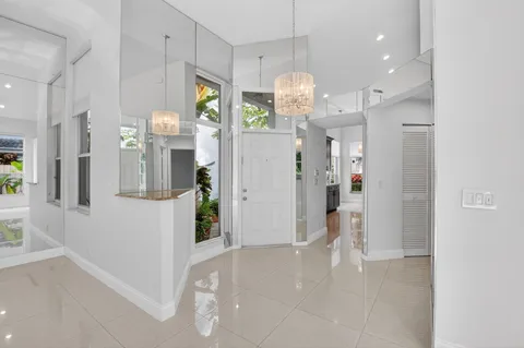 a view of a kitchen and refrigerator