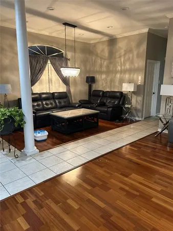 a room with wooden floor and outdoor view