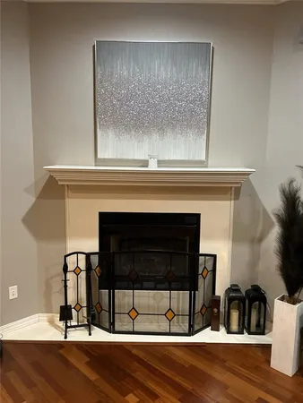 a view of fireplace and wooden floor