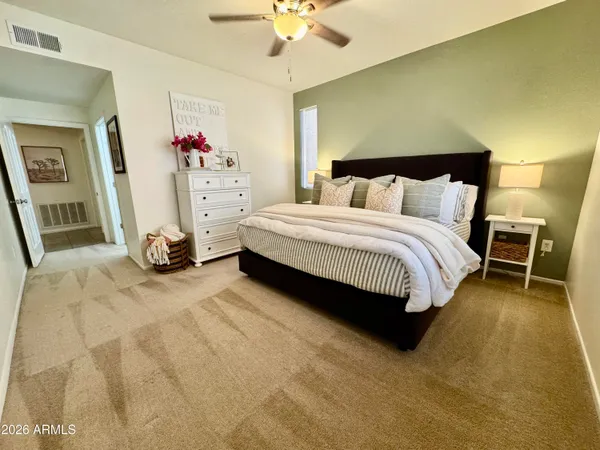 a room with gym equipment and view of living room