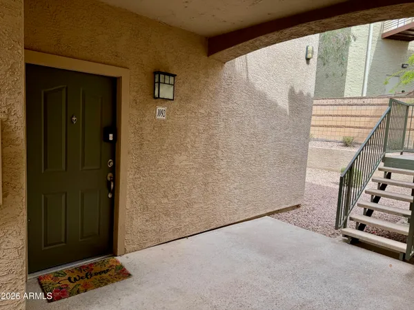 a living room with furniture and kitchen view