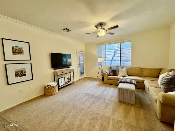 a spacious bathroom with a granite countertop sink a toilet a mirror a vanity and shower
